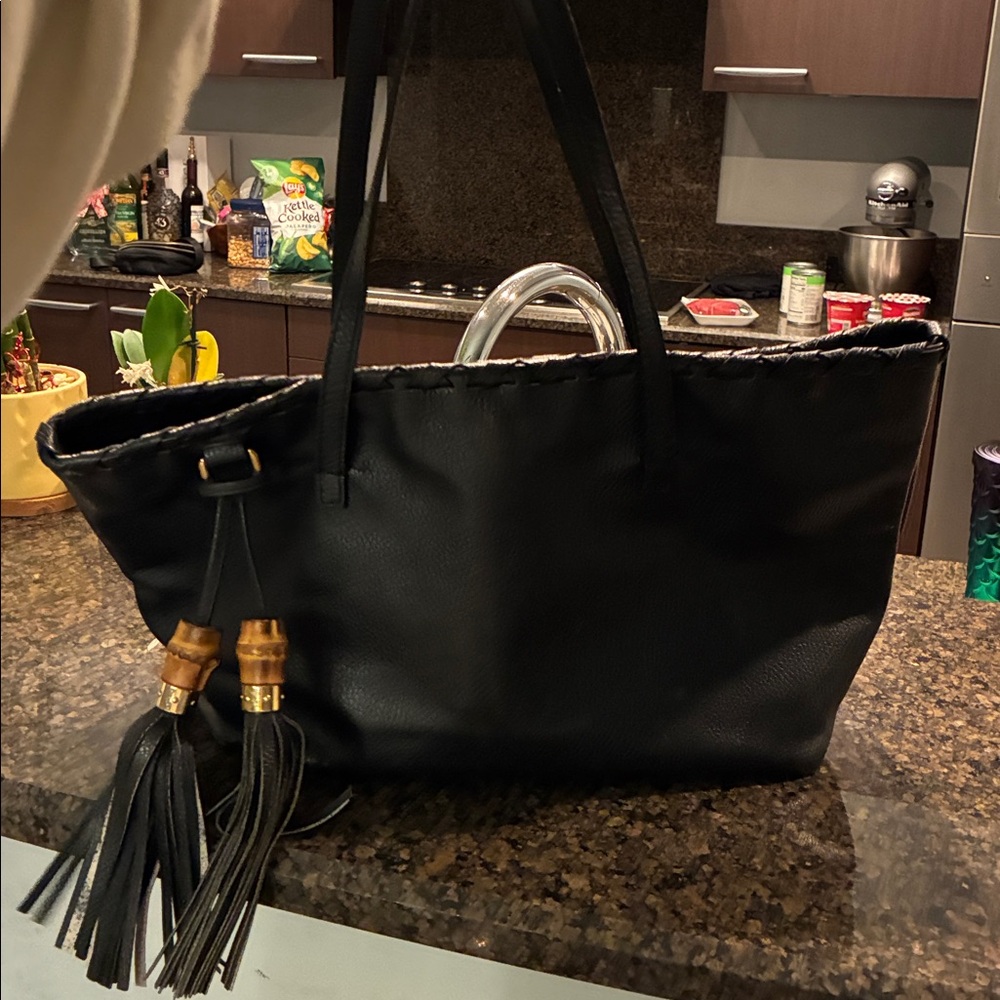 Gucci Black Leather Tote Bag
17 inches wide, 10 inches tall